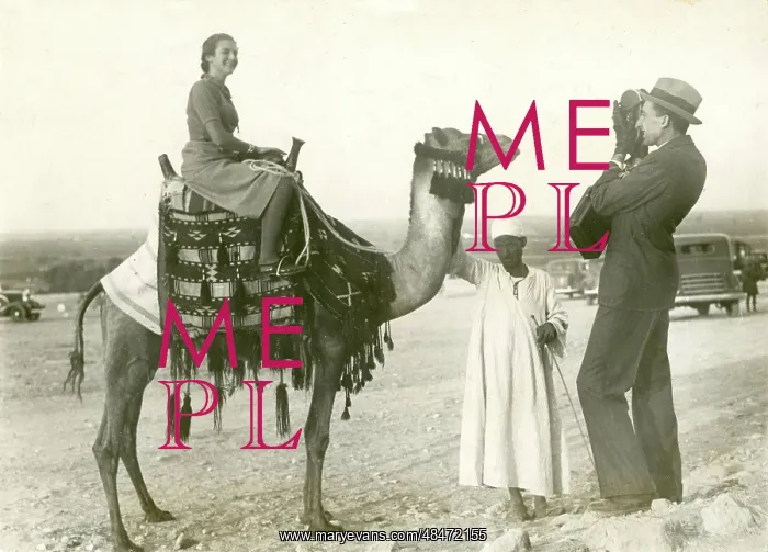 : Lady Tourist on camel - Giza, Egypt : Lady Tourist on camel - Giza, Egypt