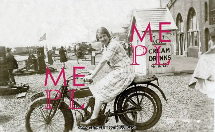 : Lady on vintage motorcycle at the seaside : Lady on vintage motorcycle at the seaside