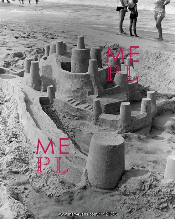 : Large detailed sand castle with moat and several : Large detailed sand castle with moat and several