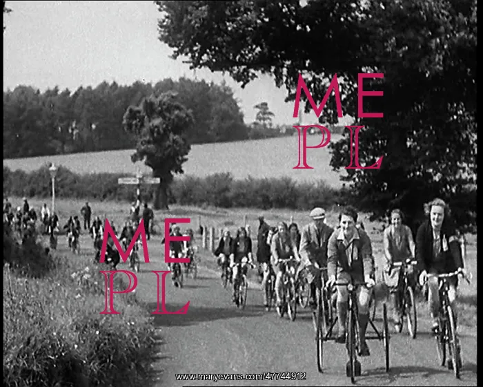 : Large Group of Civilians Riding Bicycles Through : Large Group of Civilians Riding Bicycles Through