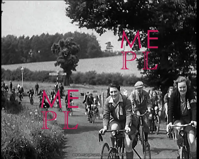 : Large Group of Civilians Riding Bicycles Through : Large Group of Civilians Riding Bicycles Through