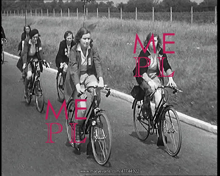 : Large Group of Civilians Riding Bicycles Through : Large Group of Civilians Riding Bicycles Through