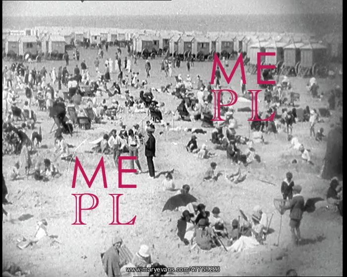: Large Group Sitting and Standing on the Beach : Large Group Sitting and Standing on the Beach