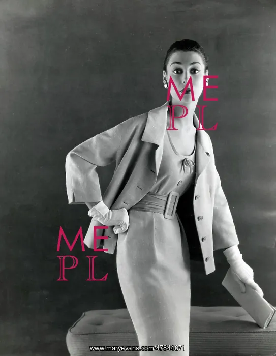 : Late 1950s model in sharp cut pale dress and jacket : Late 1950s model in sharp cut pale dress and jacket