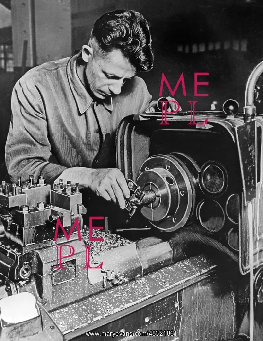 : Lathe operator at a lathe, 1930s : Lathe operator at a lathe, 1930s