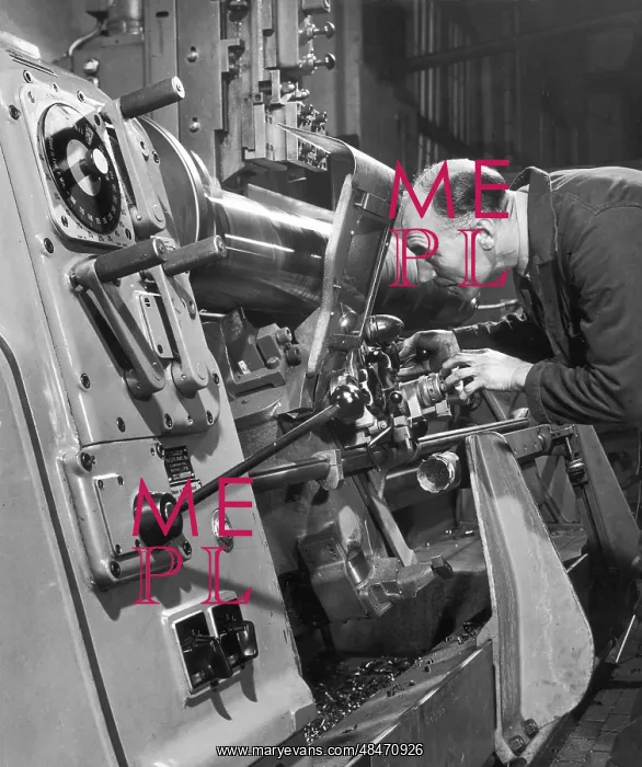 : A lathe operator at work : A lathe operator at work