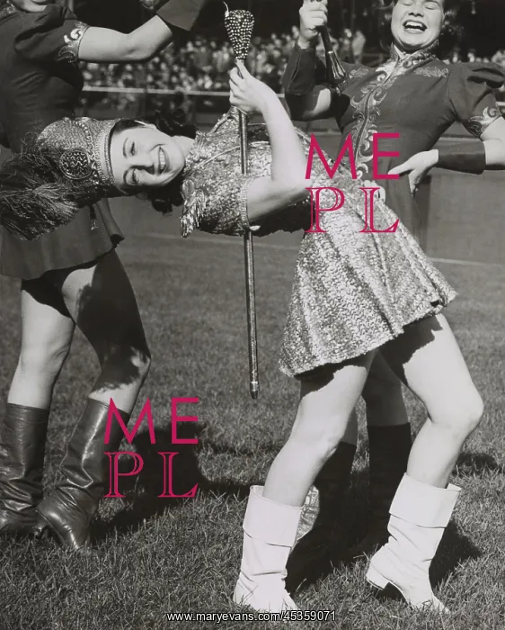 : Lead majorette, doing a back bend while holding : Lead majorette, doing a back bend while holding