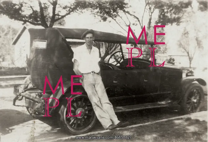 : Leaning against his motor : Leaning against his motor
