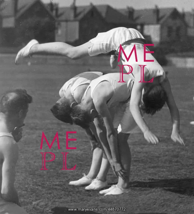  : LEAPFROG. A boy doing an impressive leapfrog over two other boys