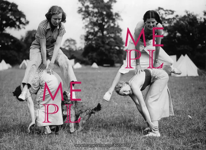: Leapfrog. Four Girls are disporting with an old children's game during : Leapfrog. Four Girls are disporting with an old children's game during