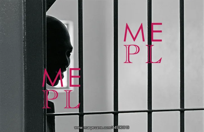 : A Leeuwkop prisoner looking through the prison bars : A Leeuwkop prisoner looking through the prison bars