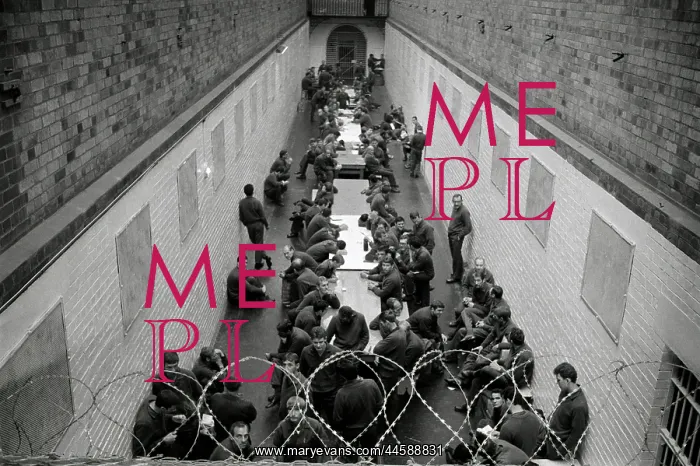 : Leeuwkop prisoners sitting at long tables in a : Leeuwkop prisoners sitting at long tables in a