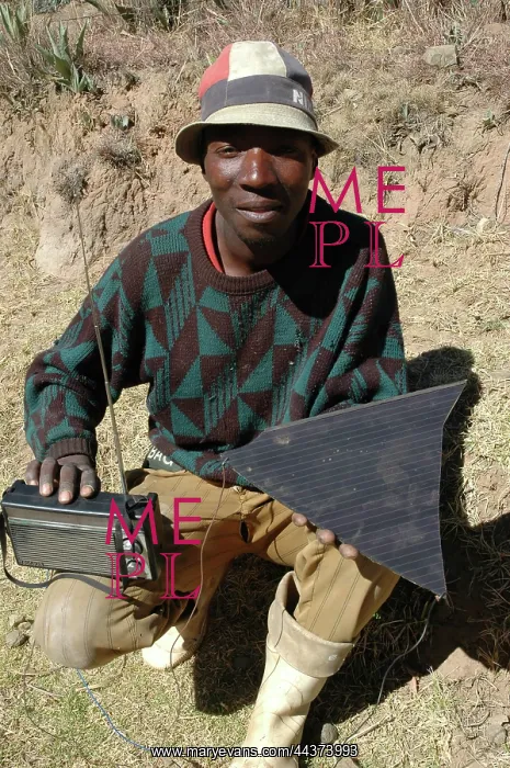 : Lesotho, 2004, A man with his radio powered by a broken : Lesotho, 2004, A man with his radio powered by a broken