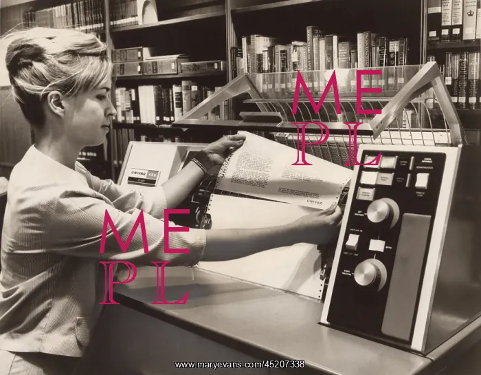 : Librarian taking a printout from a UNIVAC ? : Librarian taking a printout from a UNIVAC ?