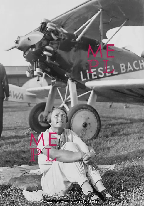 : Liesel Bach in front of her airplane, 1936 : Liesel Bach in front of her airplane, 1936