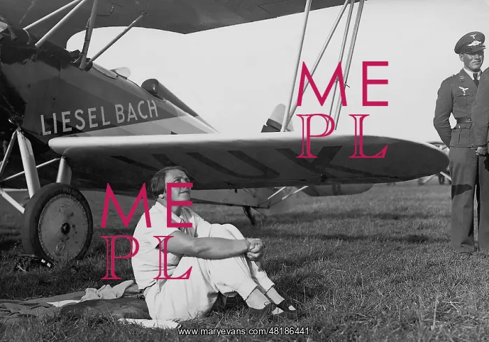 : Liesel Bach in front of her airplane, 1936 : Liesel Bach in front of her airplane, 1936