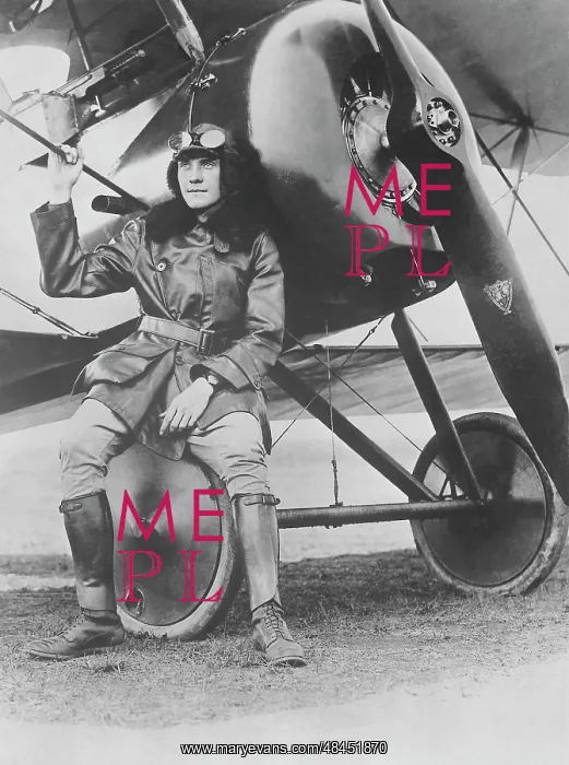 : Lieutenant Earl Carroll seated on the wheel : Lieutenant Earl Carroll seated on the wheel