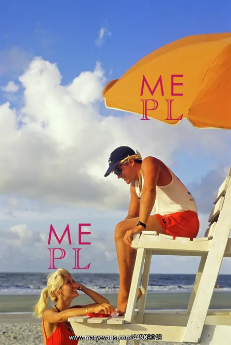 : Lifeguard Talking to Woman on Beach : Lifeguard Talking to Woman on Beach