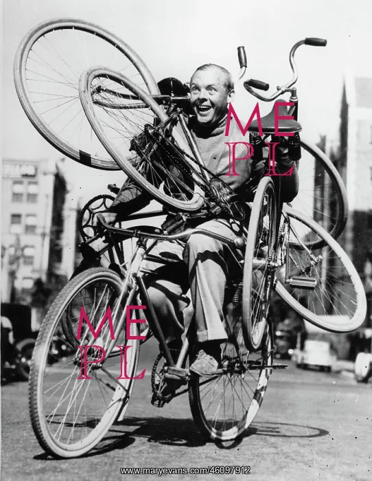 : Lincolm Stedman handling four bicycles : Lincolm Stedman handling four bicycles
