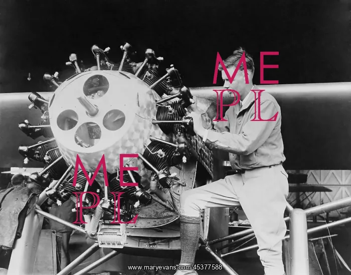 : Lindbergh examining the cylinders of the Spirit : Lindbergh examining the cylinders of the Spirit