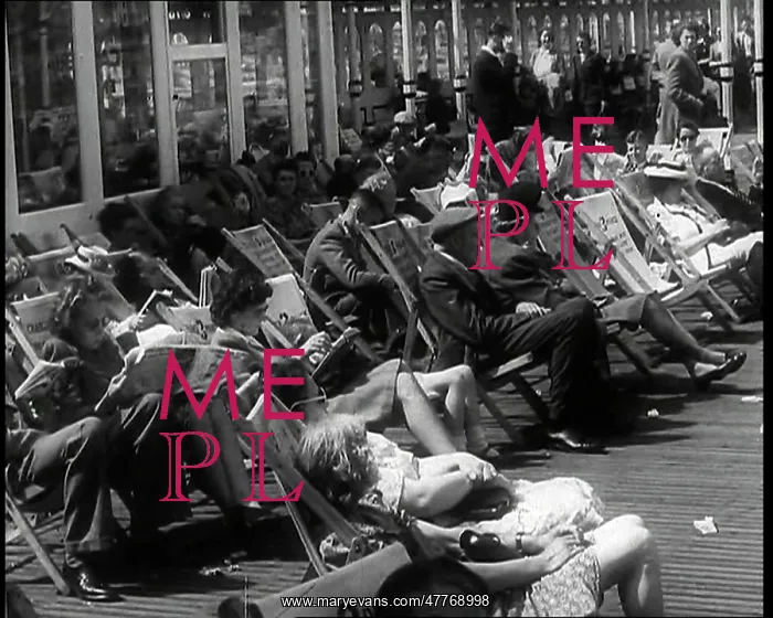 : Lines of Men and Women Sitting in Deckchairs : Lines of Men and Women Sitting in Deckchairs