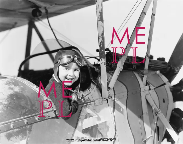 : Little boy in cockpit of plane : Little boy in cockpit of plane