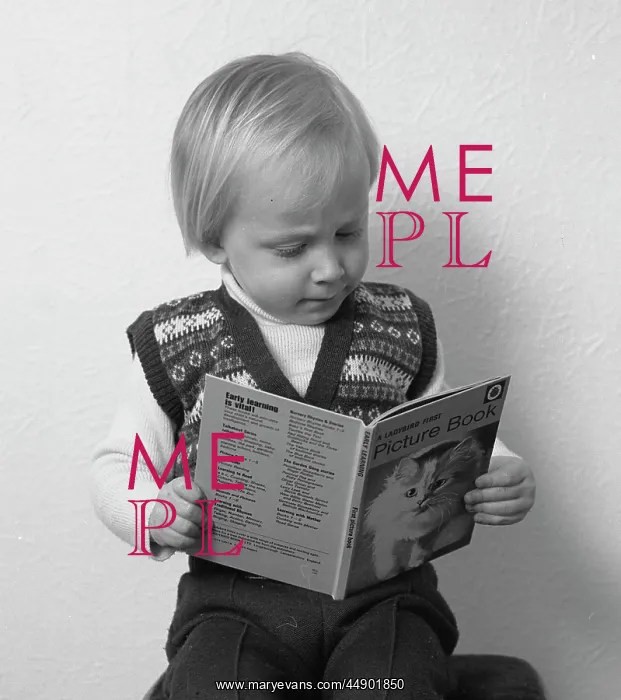 : Little boy reading a picture book : Little boy reading a picture book