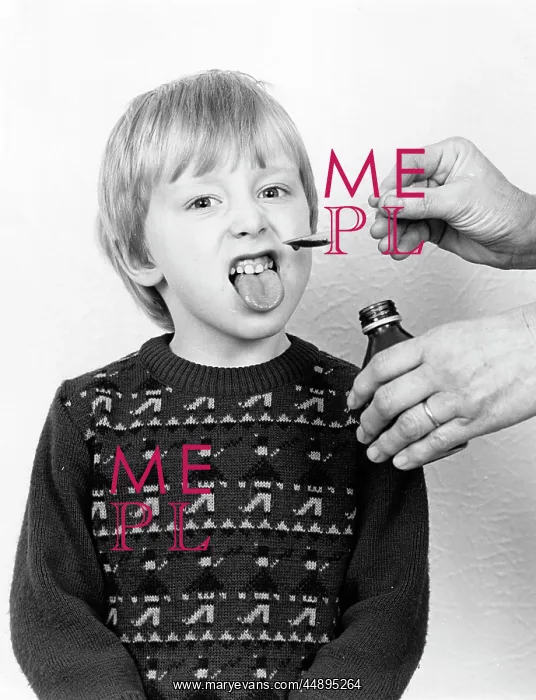 : Little boy reluctantly taking his medicine : Little boy reluctantly taking his medicine