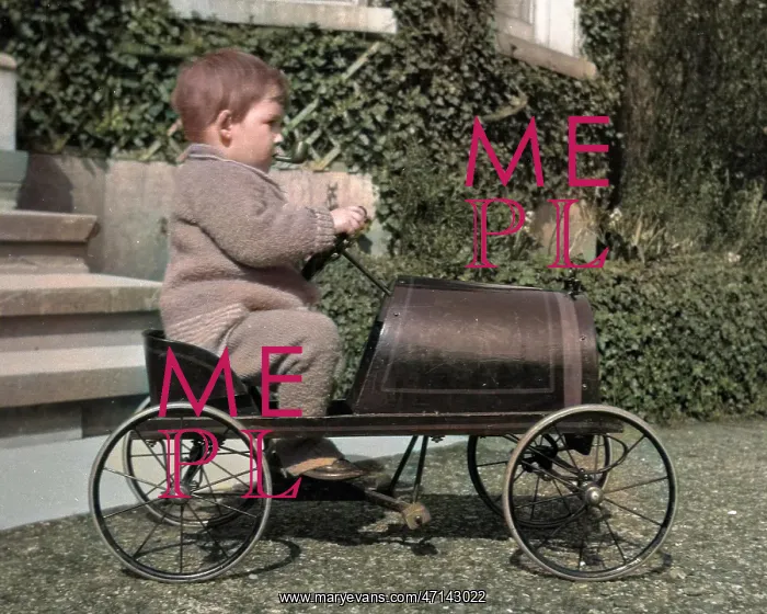 : Little boy riding in a toy car : Little boy riding in a toy car