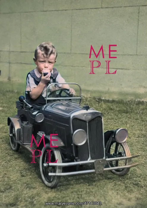: Little boy sitting in a toy car : Little boy sitting in a toy car