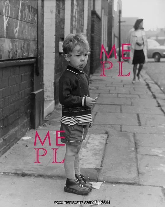 : Little boy standing on a pavement : Little boy standing on a pavement
