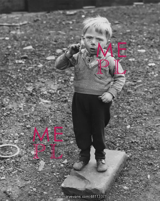 : Little boy standing on waste ground : Little boy standing on waste ground