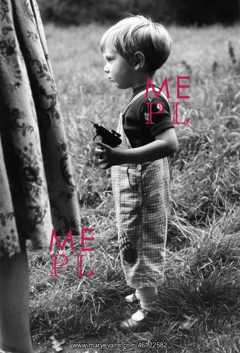 : Little boy with a toy spud gun : Little boy with a toy spud gun