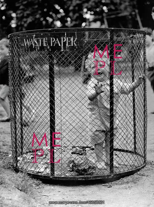 : A little boy in a wastepaper basket : A little boy in a wastepaper basket