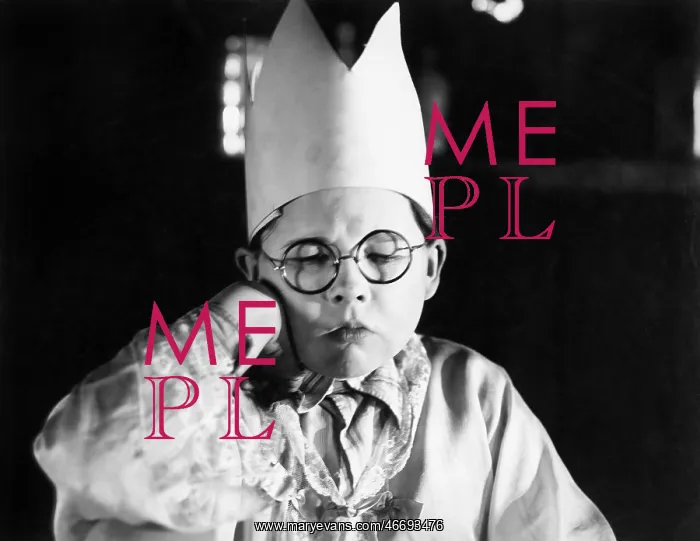 : Little boy wearing a paper crown sitting with his : Little boy wearing a paper crown sitting with his