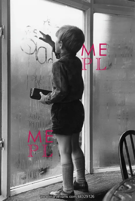 : Little boy writing on a condensated window : Little boy writing on a condensated window