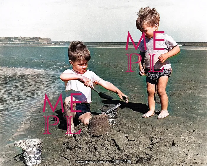 : Two little boys making sandcastle on beach : Two little boys making sandcastle on beach