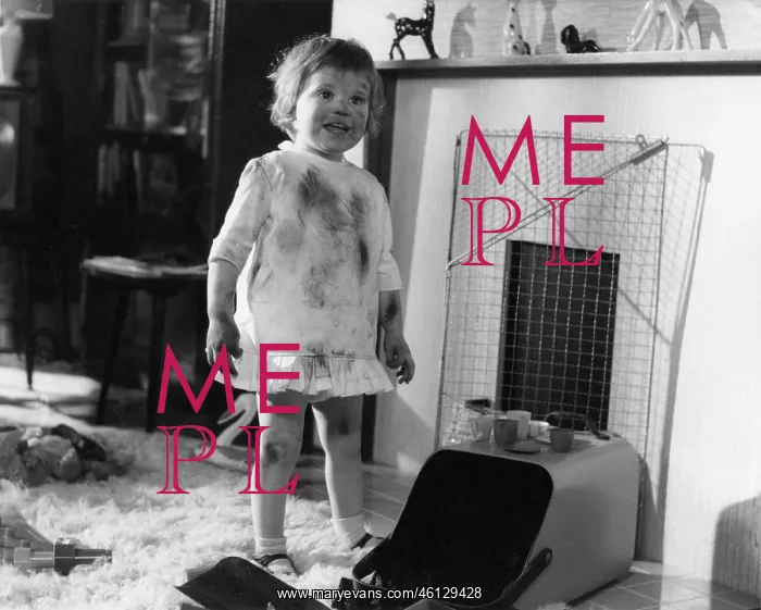  : Little girl having fun with the coal scuttle
