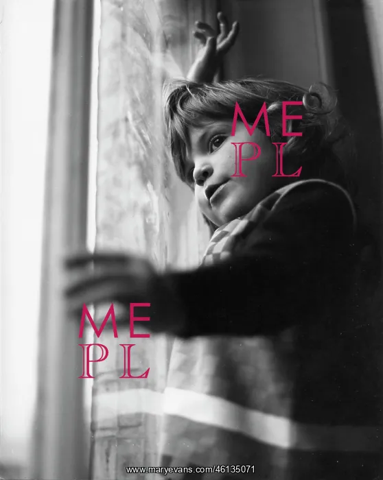 : Little girl looking through a window : Little girl looking through a window