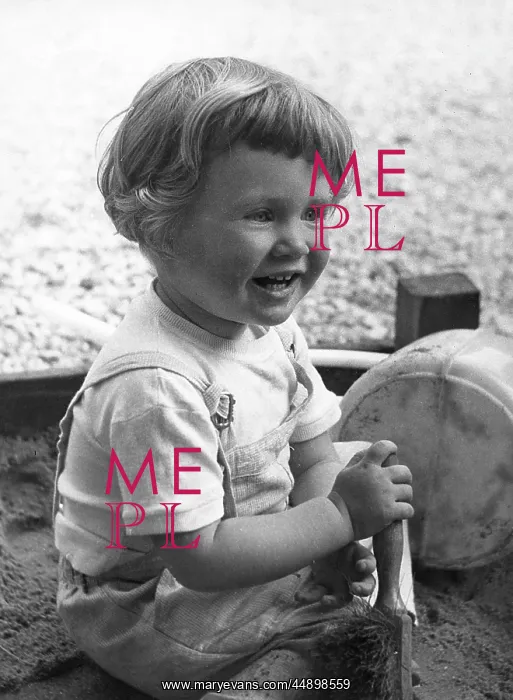  : Little girl playing in sandpit