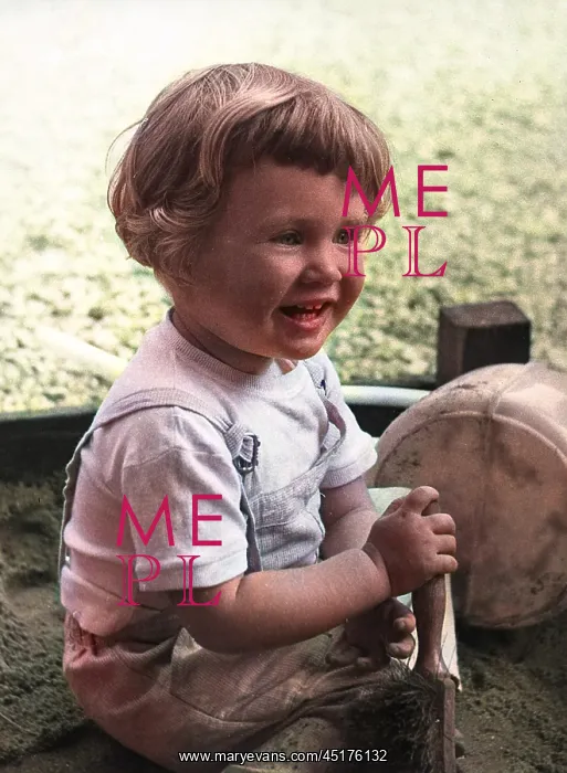  : Little girl playing in sandpit