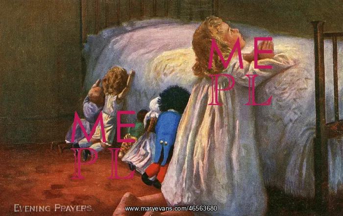 : A little girl says her evening prayers by her bedside : A little girl says her evening prayers by her bedside