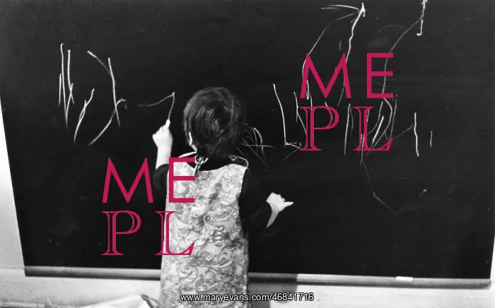 : Little girl writing on a blackboard : Little girl writing on a blackboard