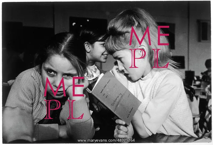 : Little girls with school notebook in a classroom : Little girls with school notebook in a classroom