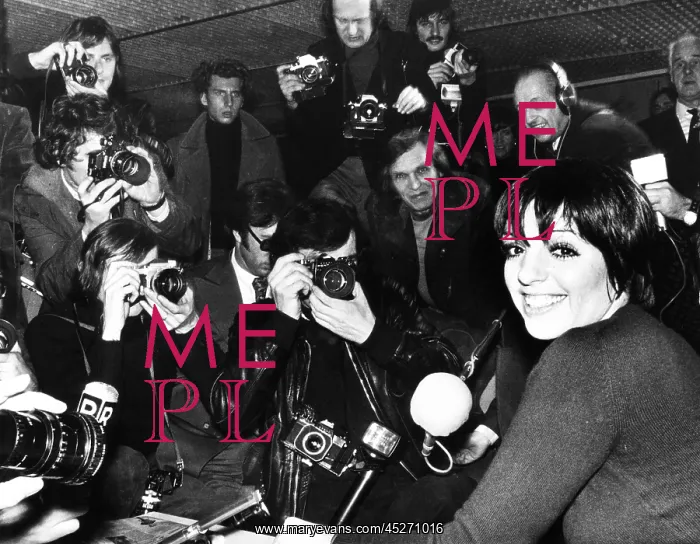 : Liza Minnelli is surrounded by photographers during : Liza Minnelli is surrounded by photographers during