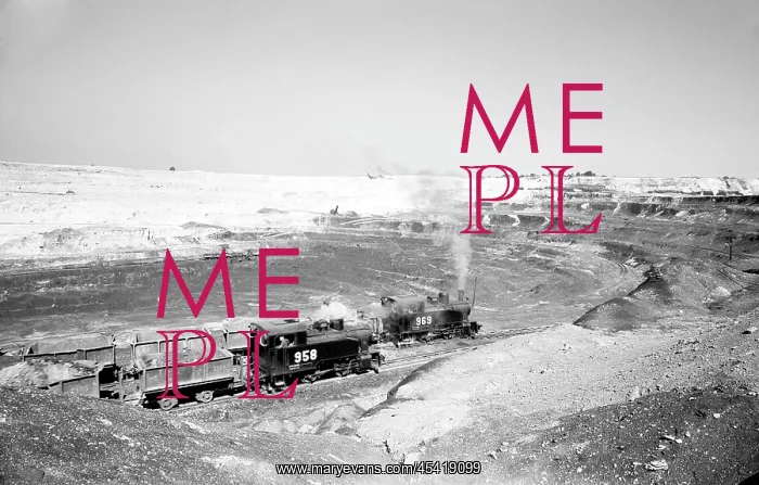 : Locomotives pull wagons to load ore : Locomotives pull wagons to load ore