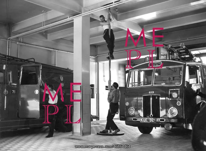  : London firefighters sliding down a pole