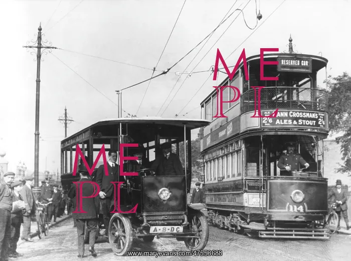 : A London tram overtaking a trolleybus : A London tram overtaking a trolleybus