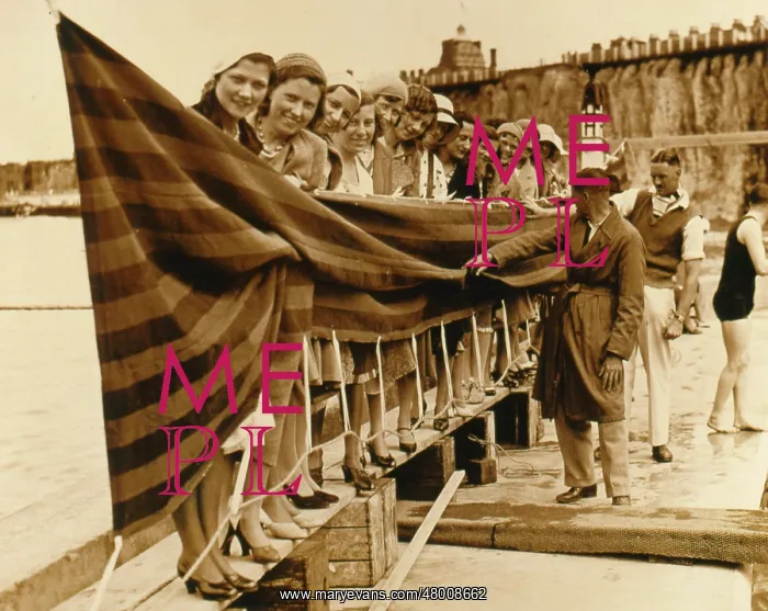 : Long line of bathing beauties at the seaside : Long line of bathing beauties at the seaside