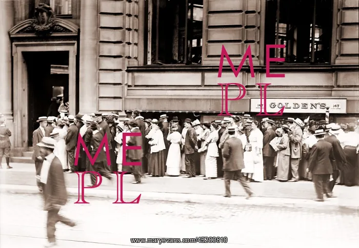 : A long line of men and women line up in ? : A long line of men and women line up in ?